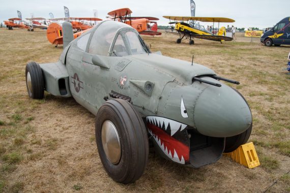 (presumably) 2017 Trudeau Warbird Enterprises P40-inspired rat rod. Built from a T-28 fuselage and a GM engine.