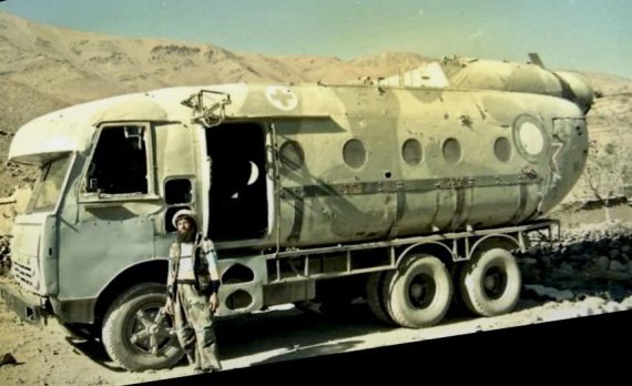 Afghani soldier makes bus out of downed Russian MI-8 helicopter