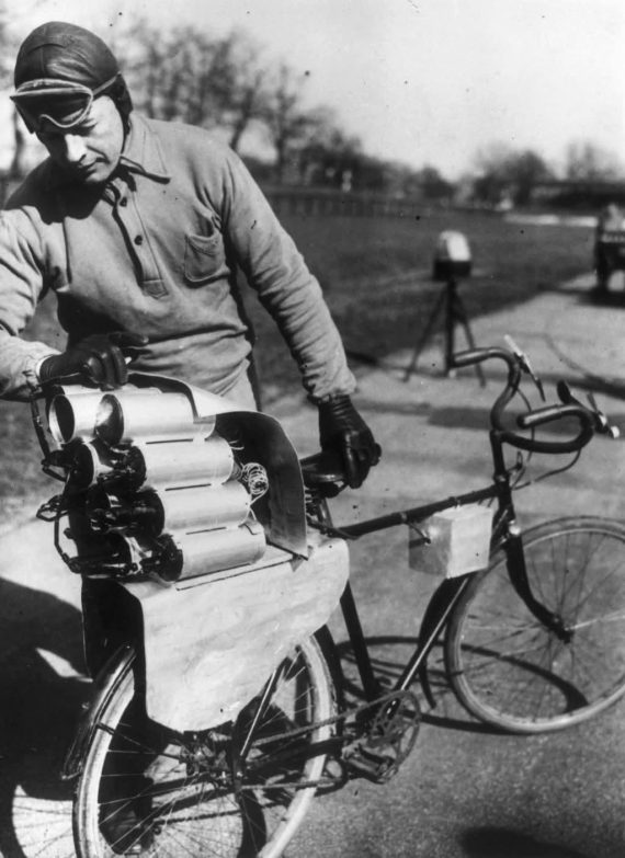 Rocket-Propelled Bicycle. In this 1931 picture, a German engineer prepares his rocket bicycle with 12 rockets mounted on the back wheel.