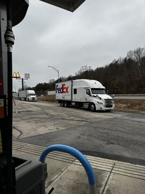 A very large truck with a very small trailer